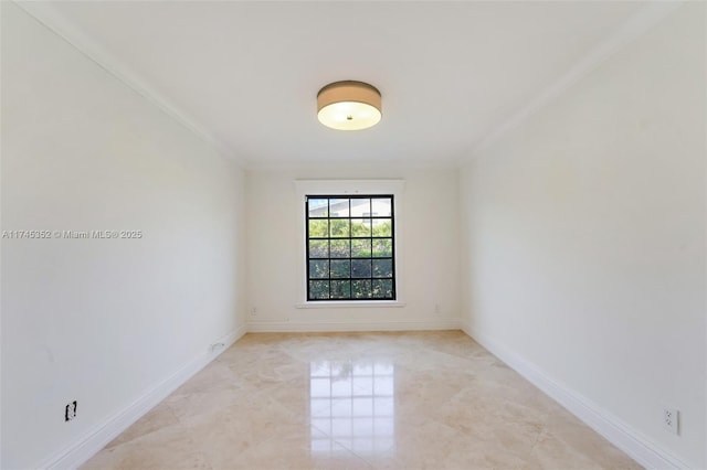 empty room featuring crown molding