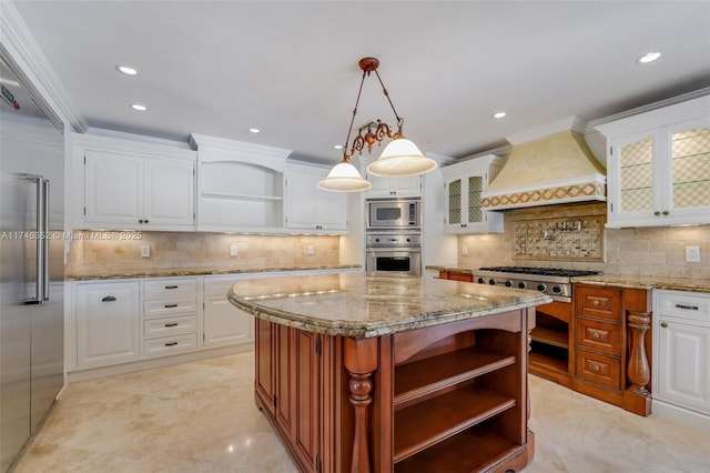 kitchen with premium range hood, a kitchen island, and white cabinets