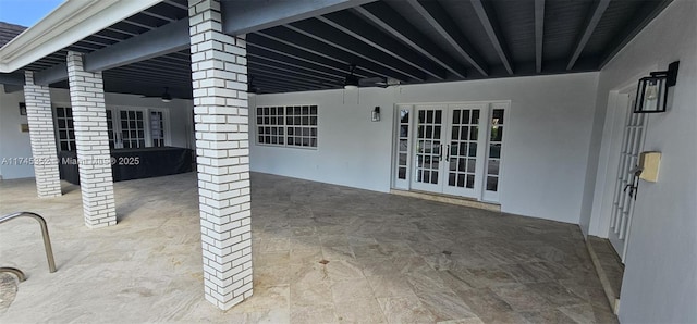 view of patio with ceiling fan and french doors