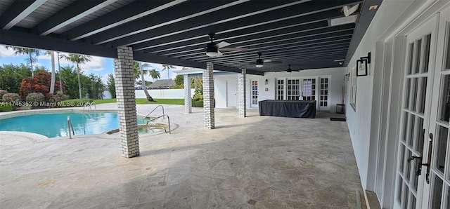 view of pool featuring french doors, ceiling fan, and a patio