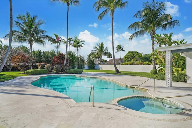 view of swimming pool featuring an in ground hot tub and a patio