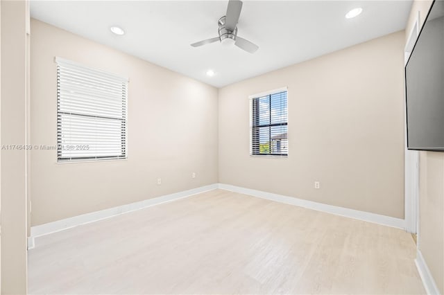 unfurnished room featuring light hardwood / wood-style flooring and ceiling fan