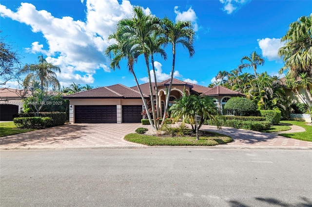 mediterranean / spanish-style home featuring a garage