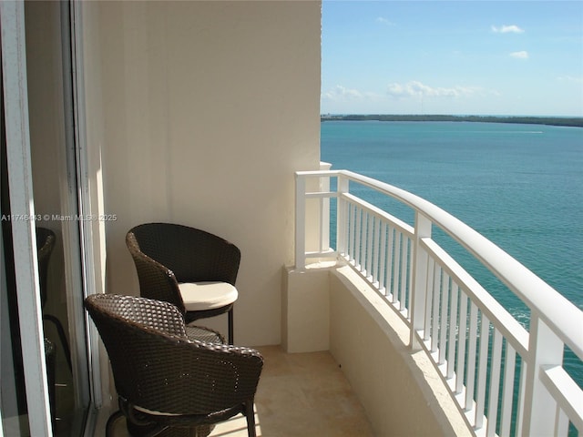 balcony featuring a water view