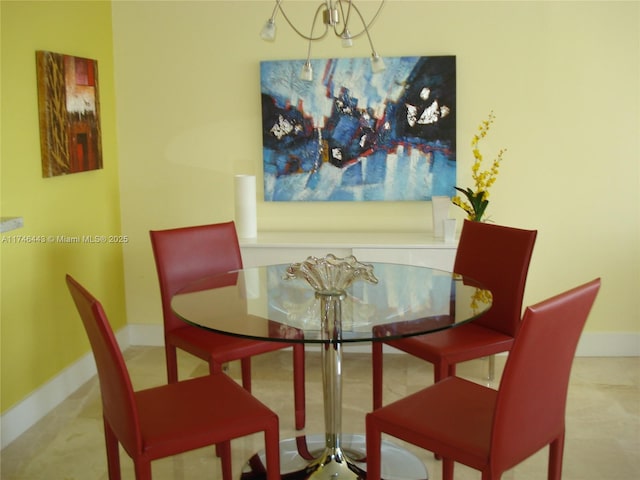 770 Claughton Island Dr Unit 1708, Miami, FL 33131 - dining space featuring baseboards and a chandelier