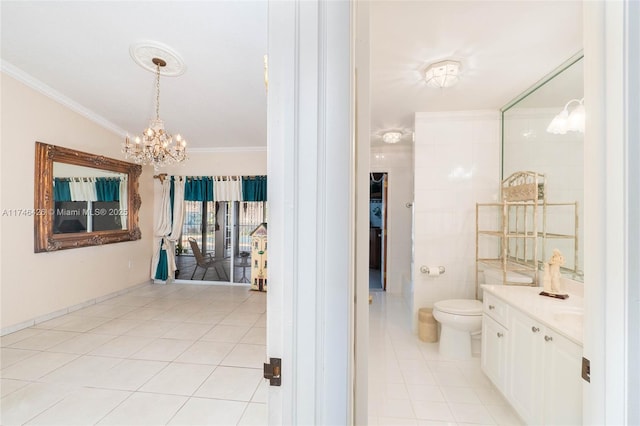 bathroom featuring ornamental molding, vanity, toilet, tile patterned floors, and an inviting chandelier