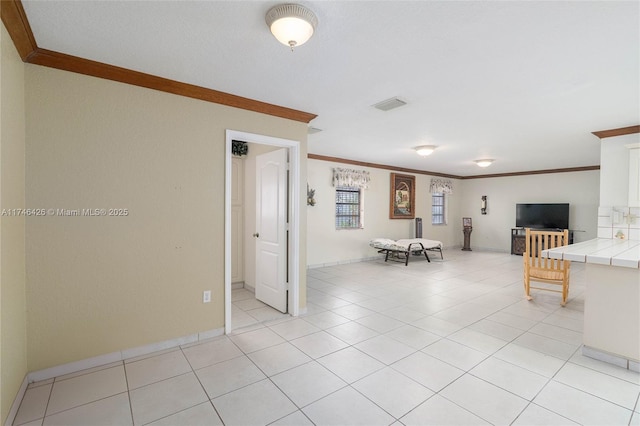 unfurnished living room with light tile patterned floors and crown molding