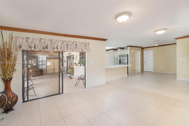 unfurnished room featuring light tile patterned floors and ornamental molding