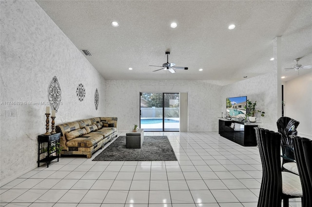 tiled living room featuring ceiling fan