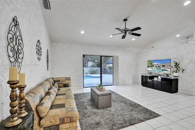 tiled living room with ceiling fan and a textured ceiling