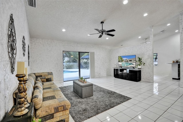 tiled living room with a textured ceiling and ceiling fan