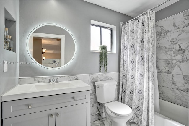 full bathroom featuring shower / bathtub combination with curtain, vanity, tile walls, and toilet