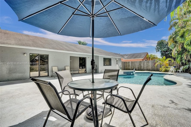 view of pool with pool water feature and a patio area