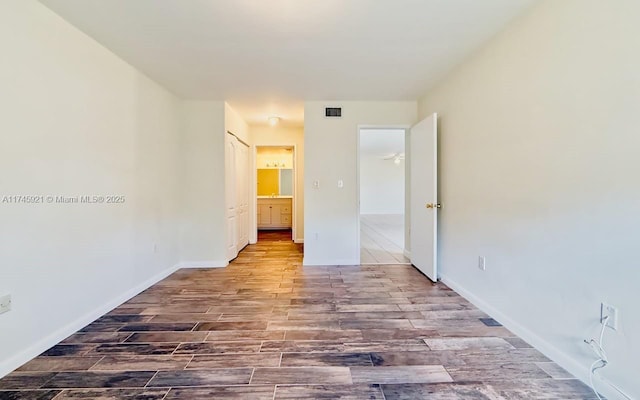 unfurnished bedroom featuring wood-type flooring