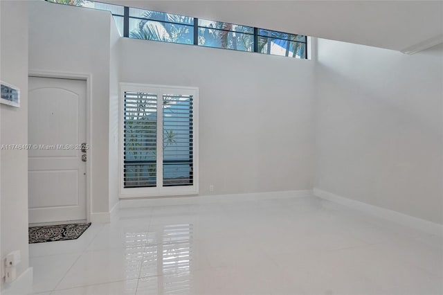 tiled entrance foyer with a wealth of natural light