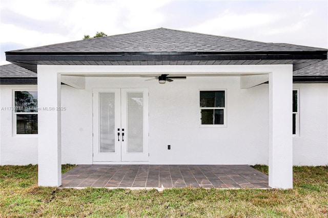 rear view of house featuring a patio area, french doors, ceiling fan, and a lawn