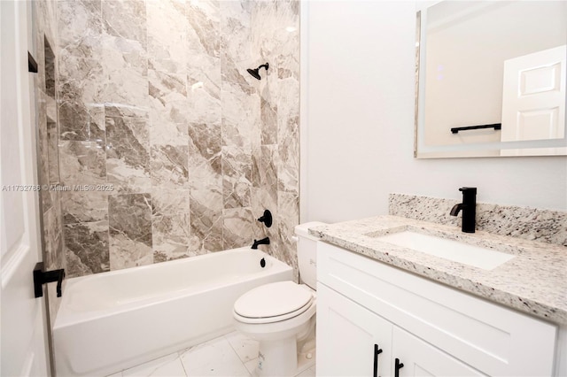 full bathroom featuring vanity, toilet, and tiled shower / bath