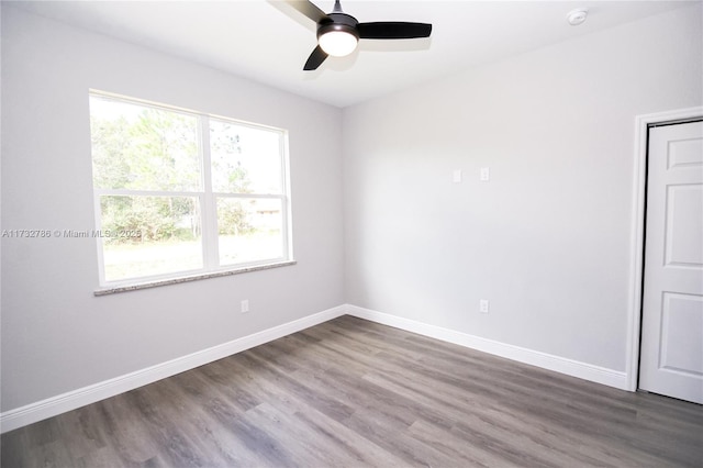 unfurnished room featuring hardwood / wood-style flooring and ceiling fan