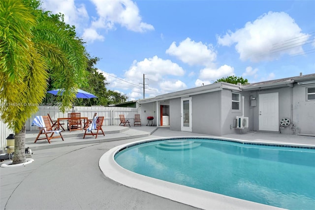 view of pool with a patio, fence, and a fenced in pool