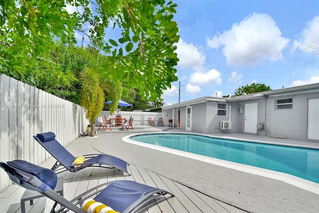 view of swimming pool with a fenced in pool, a fenced backyard, and a patio