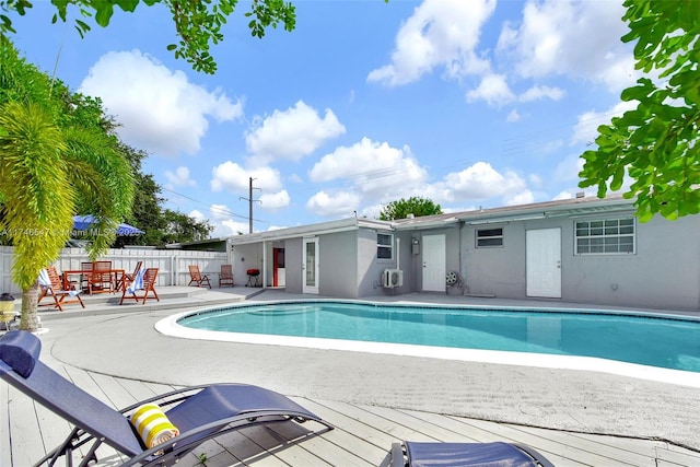 view of swimming pool with a patio area, fence, and a fenced in pool