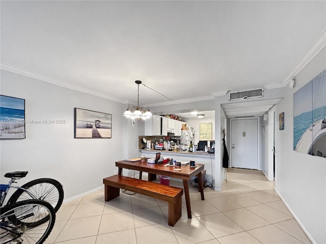 dining room featuring light tile patterned floors, visible vents, an inviting chandelier, ornamental molding, and baseboards