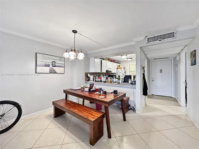 dining area featuring crown molding, light tile patterned floors, visible vents, a chandelier, and baseboards