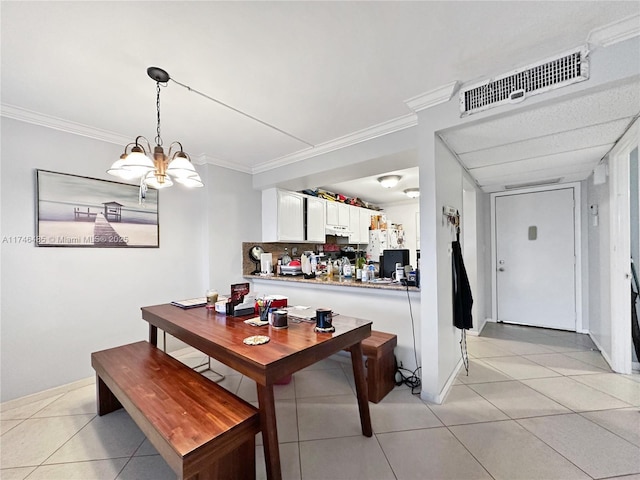 dining room with light tile patterned floors, ornamental molding, and visible vents