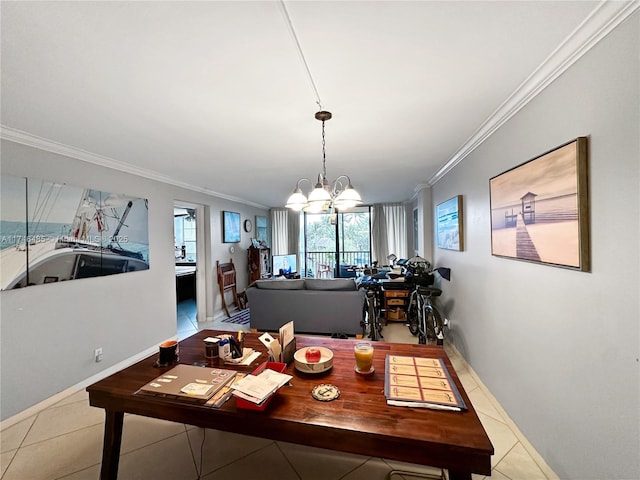 dining space with a chandelier, tile patterned flooring, crown molding, and baseboards