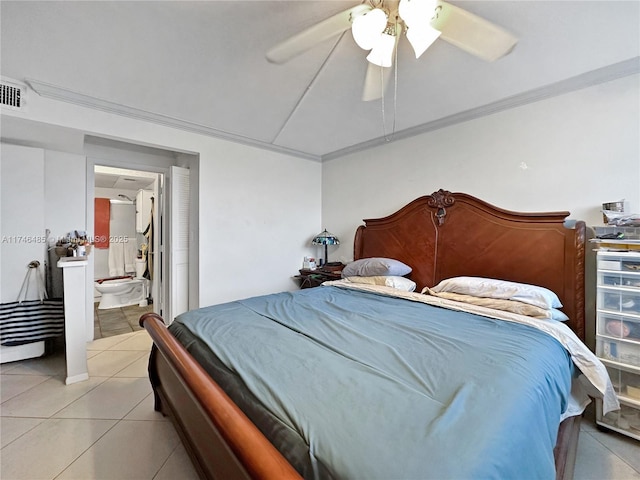 bedroom featuring ornamental molding, ceiling fan, ensuite bath, and light tile patterned floors