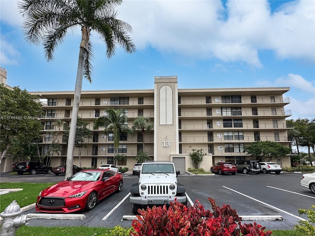 view of property featuring uncovered parking