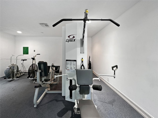 workout area with visible vents and baseboards