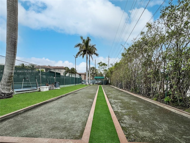 view of community with fence