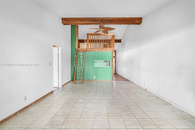 unfurnished living room with ceiling fan, high vaulted ceiling, light tile patterned flooring, and beam ceiling