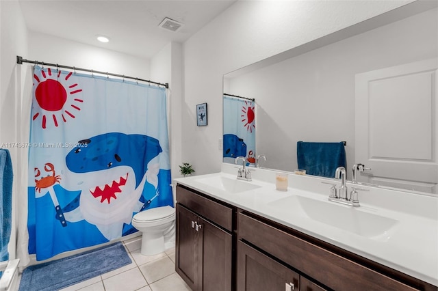 bathroom with tile patterned flooring, vanity, a shower with curtain, and toilet