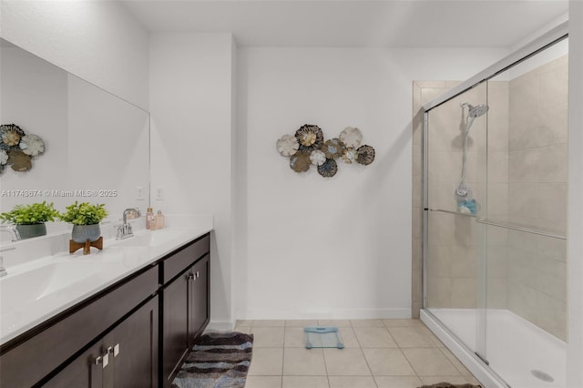 bathroom featuring vanity, tile patterned floors, and a shower with shower door