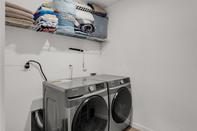 laundry area with independent washer and dryer