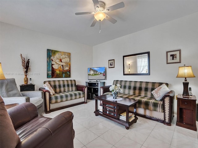 living room featuring light tile patterned floors and ceiling fan