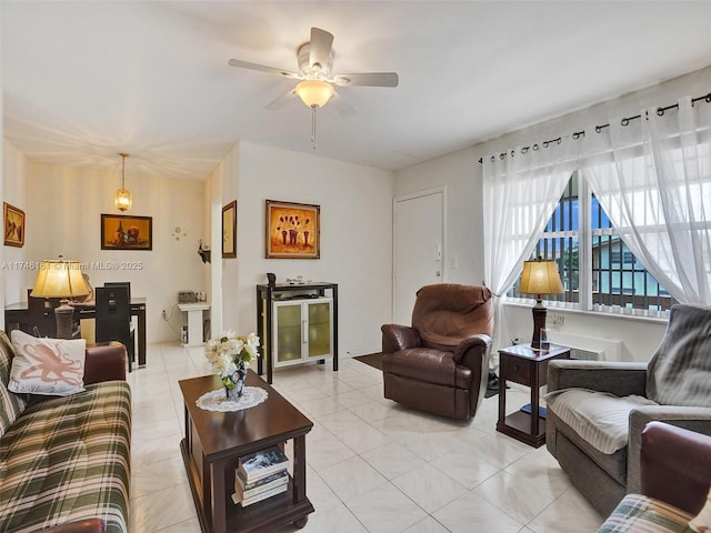 tiled living room with ceiling fan