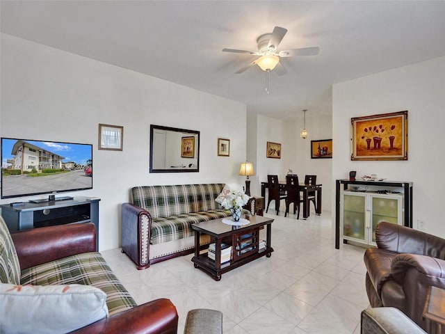 living room featuring light tile patterned flooring and ceiling fan