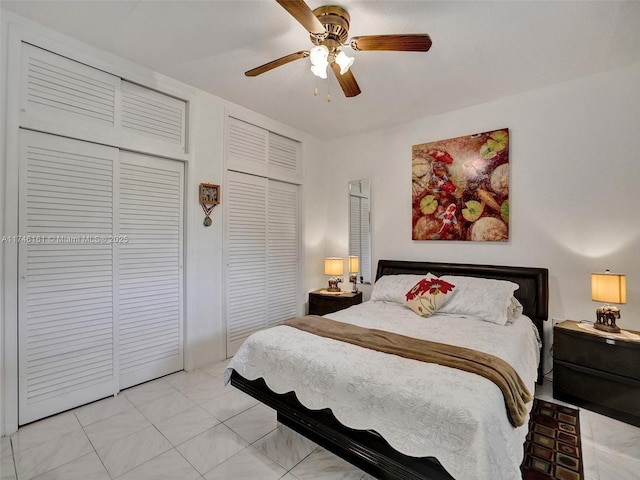 bedroom featuring multiple closets and ceiling fan