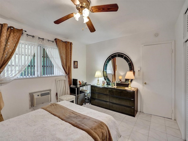 bedroom with ceiling fan, light tile patterned flooring, and a wall unit AC