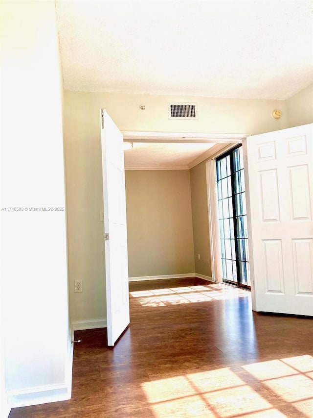 spare room with hardwood / wood-style floors