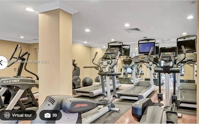 exercise room with crown molding