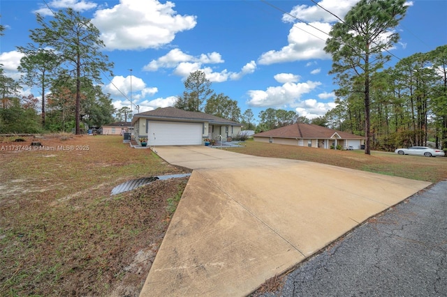 view of front of home featuring a garage, driveway, and a front lawn