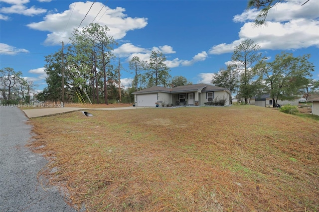 view of front of house with a front lawn and an attached garage