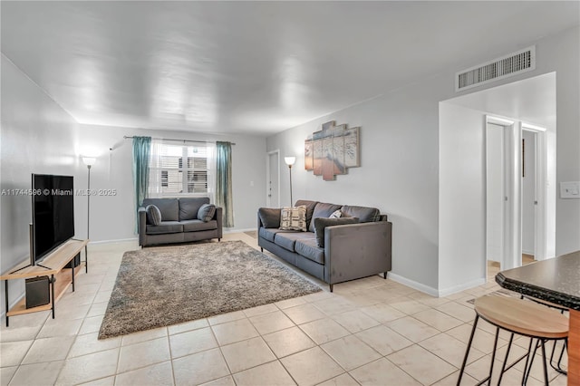 living room with light tile patterned floors