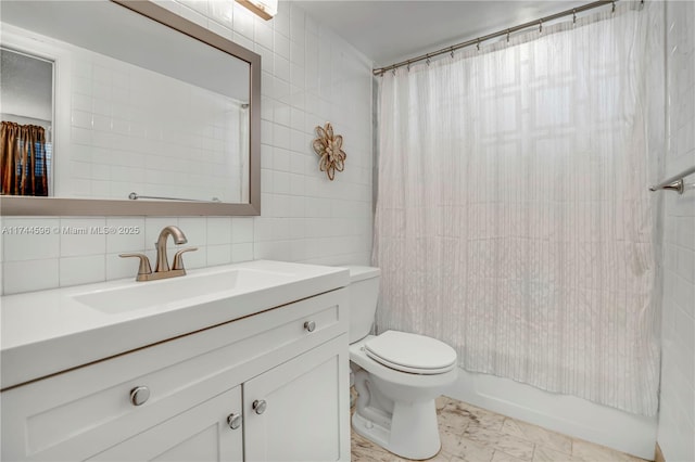 full bathroom featuring tile walls, backsplash, vanity, toilet, and shower / bath combo with shower curtain