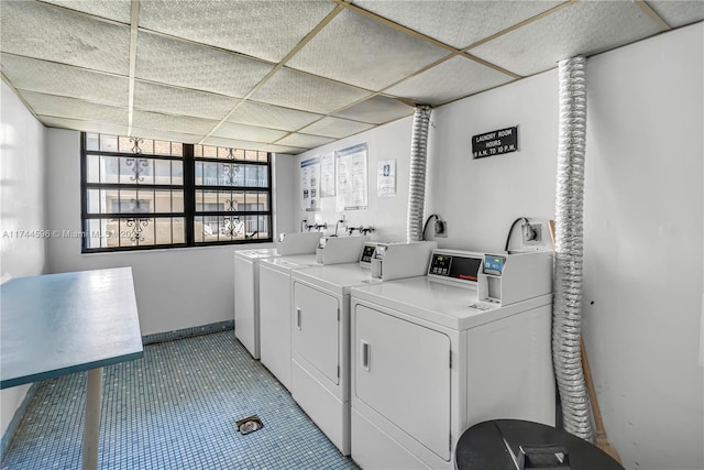 clothes washing area featuring separate washer and dryer