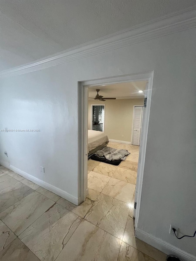 766 E 48th St, Hialeah, FL 33013 - hall with crown molding, a textured ceiling, marble finish floor, and baseboards